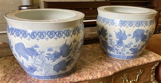 A pair of modern Chinese blue and white fish bowls, 45cm diameter